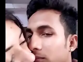 Girlfriend boyfriend kissing in a apartment